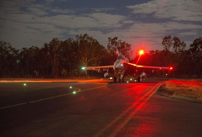An F/A-18C Hornet assigned to Marine Fighter Attack Squadron (VMFA) 122 taxis to the runway for a night flight during Exercise Pitch Black 2016 at Royal Australian Air Force Base Tindal, Australia, Aug. 17, 2016. The flying squadron executed large force close air support, air interdiction, armed reconnaissance, and strike coordination and reconnaissance missions over the three week training evolution. The biennial, multinational exercise involves approximately 10 allied nations and prepares these forces for possible real-world scenarios. The bilateral effort amongst Exercise Pitch Black 2016 furthermore showcases the strength amongst various militaries and solidifies the relationship across the Pacific region. (U.S. Marine Corps photo by Cpl. Nicole Zurbrugg)