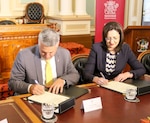 BRISBANE, Australia (Aug 17, 20016) Queensland Premier Annastacia Palaszczuk and U.S. Deputy Under Secretary of the Navy for Management Thomas Hicks sign a Statement of Cooperation to work in support of projects that advance shared interests. The agreement spells out a commitment for the U.S. Navy and the State of Queensland to hold discussions on the research, development, supply and sale of alternative fuels, which can improve operational flexibility and increase energy security. (U.S. Navy photo by Chief Mass Communication Specialist Hendrick Simoes/Released)