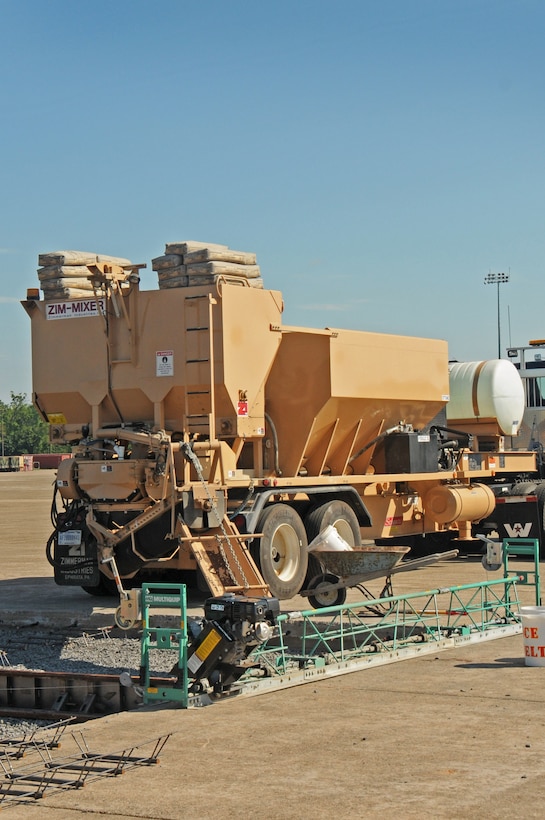 The Zim-Mixer volumetric concrete mixer sits on the flight line at Horsham Air Guard Station, Pa., Aug. 14, 2016. The device holds each element of concrete in separate sections and aggregates them as needed which reduces the amount of wasted material.  To improve their knowledge of the equipment, the “Dirt Boys” used the mixer to lay a concrete slab in their training area. (U.S. Air National Guard photo by Senior Airman Timi Jones)