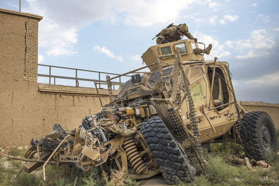 An Air Force pararescueman provides aid to Senior Airman Joshua Calara during mass casualty and extraction exercises at Bagram Airfield, Afghanistan, Aug. 18, 2016. The pararescueman is assigned to the 83rd Expeditionary Rescue Squadron. Calara is an armament systems technician assigned to the 455th Expeditionary Maintenance Squadron. The pararescueman trained with soldiers assigned to the 717th Explosive Ordinance Disposal Unit to increase interoperability and demonstrate personnel recovery capabilities. Air Force photo by Senior Airman Justyn M. Freeman