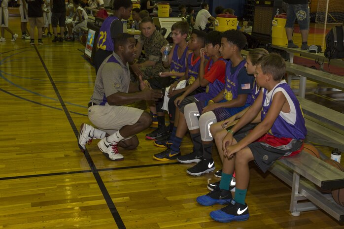 Rodney Allen, a coach with the Mainland Sports Association, addresses his team during a basketball tournament held for station residents and Japanese nationals at Marine Corps Air Station Iwakuni, Japan, Aug. 21, 2016. Forty-four athletes from Iwakuni, Hirata, Ohno, Otake and MSA-Iwakuni took to the courts to compete against each other in a series of basketball games. Established in 2009 as a nonprofit organization and formerly known as the Mainland Basketball Association, MSA conducts off-base tournaments with the Japanese teams throughout the summer. (U.S. Marine Corps photo by Lance Cpl. Aaron Henson)
