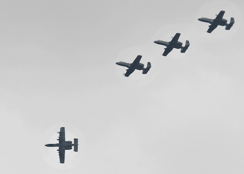 Four A-10 Thunderbolt IIs fly in formation over Osan Air Base, Republic of Korea, Aug. 23, 2016. The A-10s, all assigned to the 25th Fighter Squadron, return to base after flying a training sortie, and will continue flying sorties all week as part of Exercise Beverly Herd 16-2. (U.S. Air Force photo by Senior Airman Victor J. Caputo)