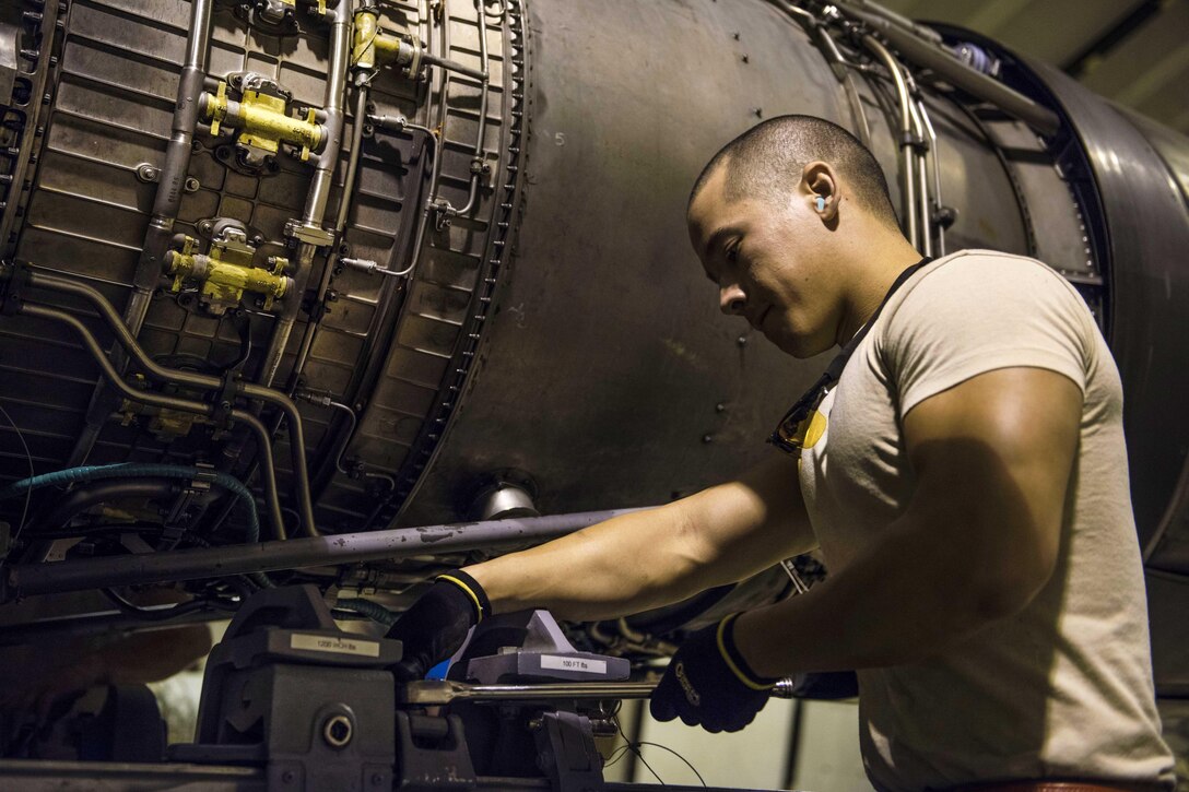 Air Force Staff Sgt. Jose Barsallo installs an engine on an F-16C Fighting Falcon aircraft at Bagram Airfield, Afghanistan, Aug. 9, 2016. Barsallo is a crew chief assigned to the 455th Expeditionary Aircraft Maintenance Squadron. Air Force photo by Senior Airman Justyn M. Freeman
