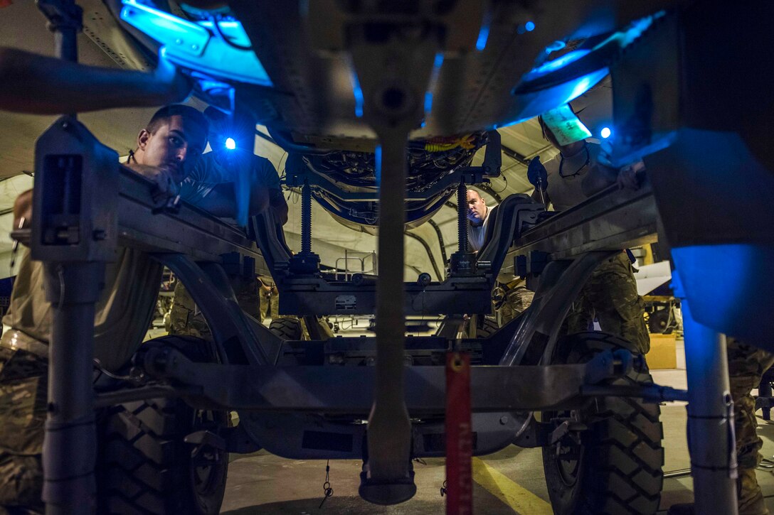 Airmen install an engine on an F-16C Fighting Falcon aircraft at Bagram Airfield, Afghanistan, Aug. 9, 2016. Air Force photo by Senior Airman Justyn M. Freeman 