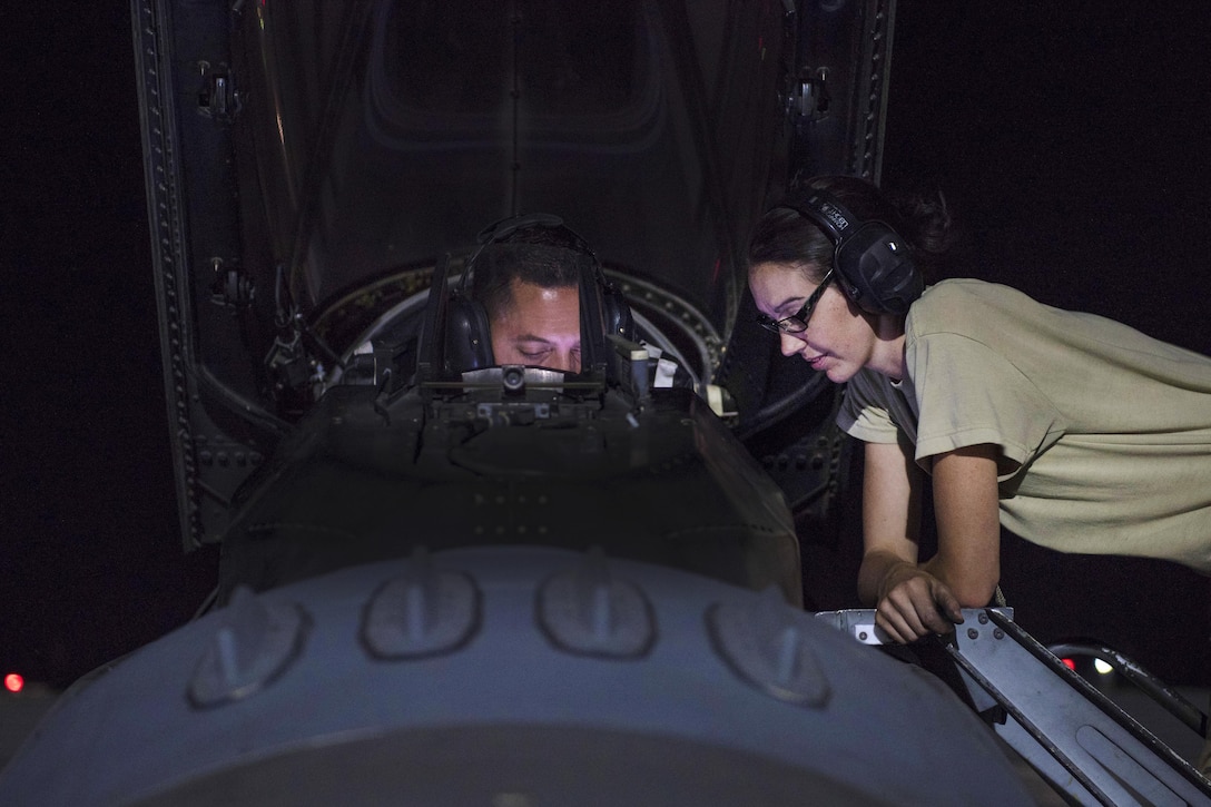 Air Force Tech. Sgts. Kaisha Gurtner, right, and Joshua Tocci perform a weapons check on an F-16C Fighting Falcon aircraft at Bagram Airfield, Afghanistan, Aug. 9, 2016. Gurtner and Tocci are weapons armament systems technicians assigned to the 455th Expeditionary Aircraft Maintenance Squadron. Air Force photo by Senior Airman Justyn M. Freeman