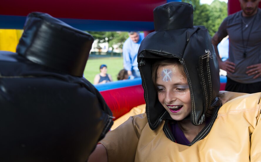 A child sumo wrestles during the Ramstein and Vogelweh Community Center’s Olympic Family Night Aug. 22, 2016 at Ramstein Air Base, Germany. The event was open to all KMC members; families of deployed members and children under three attended for free. (U.S. Air Force photo/Senior Airman Tryphena Mayhugh)