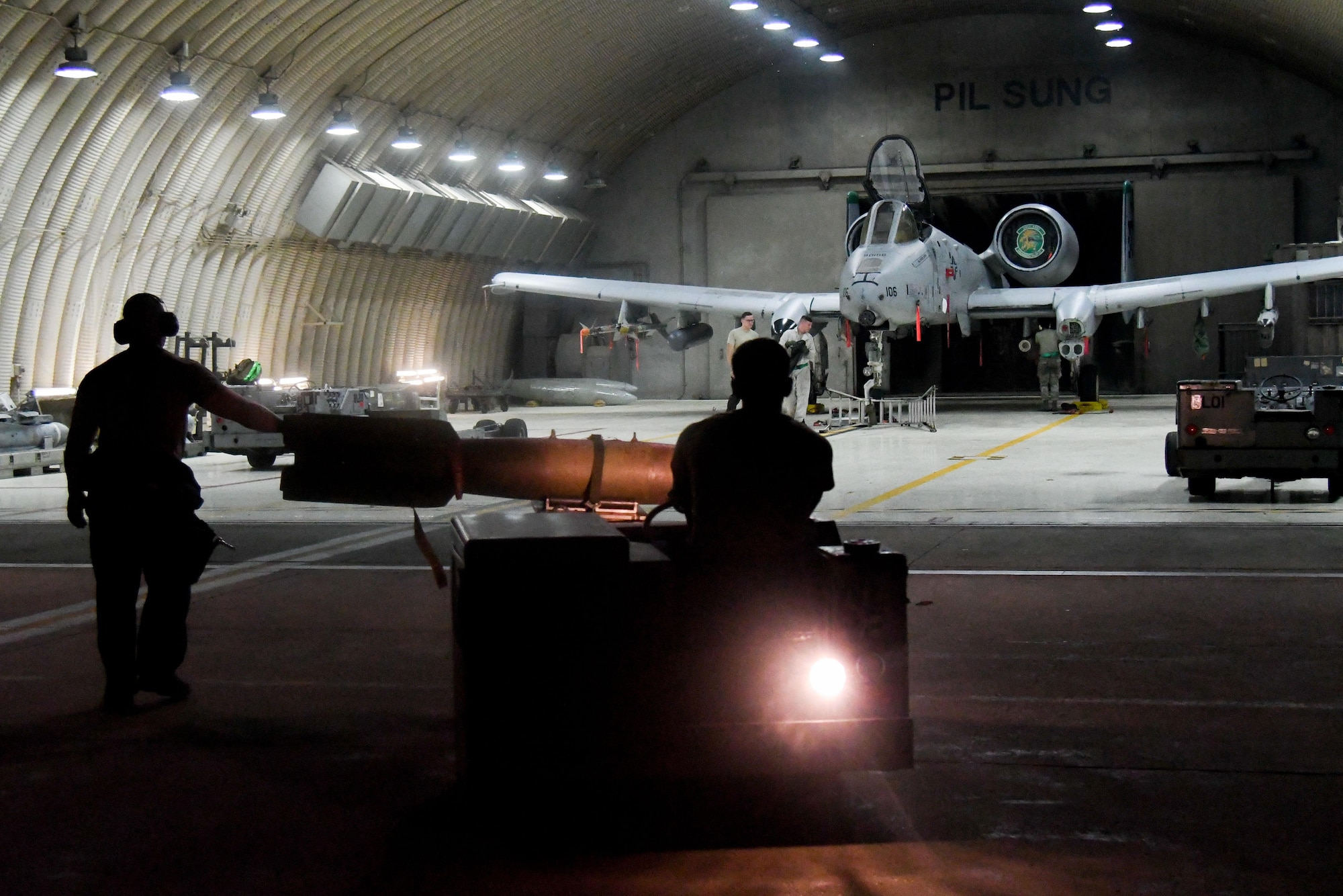 Weapons loaders from the 25th Aircraft Maintenance Unit use a MJ1C munitions lift truck to transport and load munitions onto an A-10 Thunderbolt II on Osan Air Base, Republic of Korea. The loading of weapons onto the A-10 was done as part of exercise Beverly Herd 16-2, conducted to test Osan’s ability to defend the base, execute contingency operations and sustain the force. (U.S. Air Force photo by Staff Sgt. Jonathan Steffen)