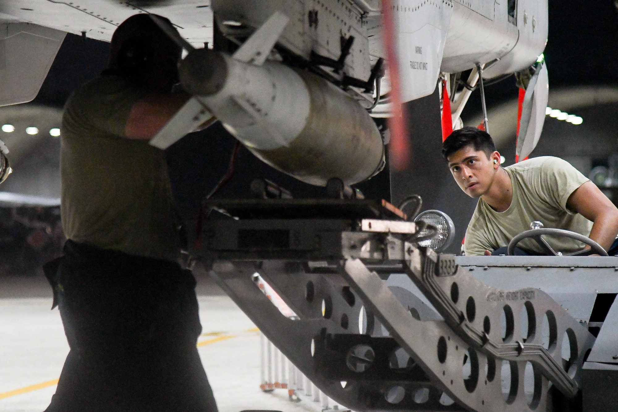 Staff Sgt. Nicholas Mischiara, 25th Aircraft Maintenance Unit weapons load crew chief and Senior Airman Alexis Benitez, 25th AMU weapons load crewmember, load munitions onto an A-10 Thunderbolt II on Osan Air Base, Republic of Korea. The loading of munitions was part of exercise Beverly Herd 16-2, designed to test the readiness of the 51st Fighter Wing. (U.S. Air Force photo by Staff Sgt. Jonathan Steffen) 