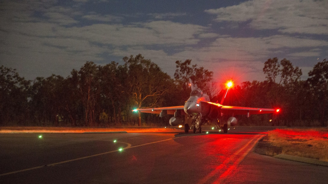 An F/A-18C Hornet assigned to Marine Fighter Attack Squadron 122 taxis to the runway for a night flight during Exercise Pitch Black 2016 at Royal Australian Air Force Base Tindal, Australia, Aug. 17, 2016. The flying squadron executed large force close air support, air interdiction, armed reconnaissance, and strike coordination and reconnaissance missions over the three week training evolution. The biennial, multinational exercise involves approximately 10 allied nations and prepares these forces for possible real-world scenarios. The bilateral effort amongst Exercise Pitch Black 2016 furthermore showcases the strength amongst various militaries and solidifies the relationship across the Pacific region.
