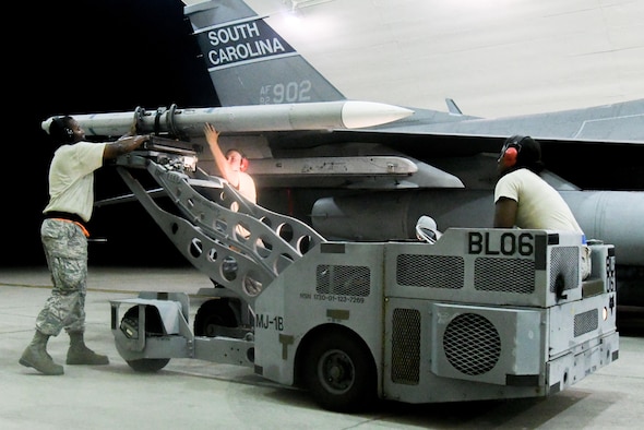 Members from the South Carolina Air National Guard 169th Aircraft Maintenance Squadron unload an AIM-120 advanced medium-range air-to-air missile from an F-16 Fighting Falcon during exercise Beverly Herd 16-2 at Osan Air Base, Republic of Korea. Beverly Herd 16-2 allows the 51st Fighter Wing and tenant units to test their abilities to survive and operate during wartime conditions. (U.S. Air Force photo by Staff Sgt. Jonathan Steffen)