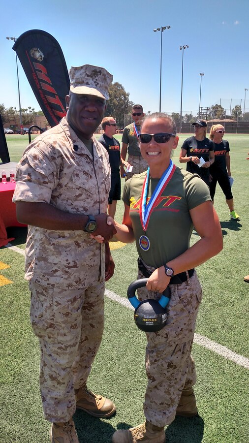 Sergeant Major of the Marine Corps Ronald Green congratulates Staff Sgt. Amanda Jenks on placing third overall among 16 female competitors at the 2016 HITT Tactical Athlete Championships Aug. 18 at Marine Corps Air Station Miramar. Jenks, a cyber systems chief with Marine Corps Forces Cyberspace Command, represented MCB Quantico at the championships. 