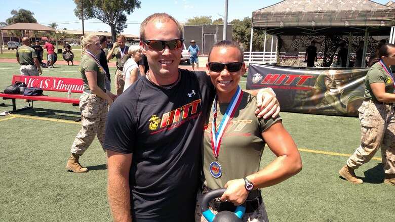 Staff Sgt. Amanda Jenks poses with Del Yackle, HITT coordinator for Marine Corps Base Quantico, at the 2016 HITT Tactical Athlete Championships Aug. 18 at Marine Corps Air Station Miramar. Jenks represented Quantico at the championships and placed third overall in the female division. 
