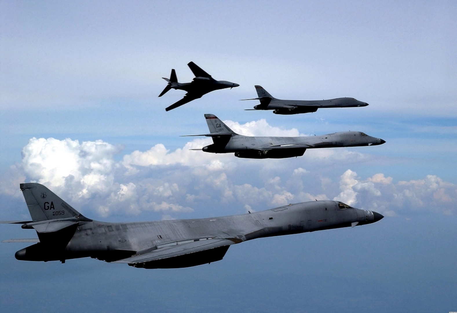 A group of Air Force B-1B Lancers soar high above the clouds. Defense Logistics Agency Aviation manages roughly 64,000 national stock numbers for the bomber.
