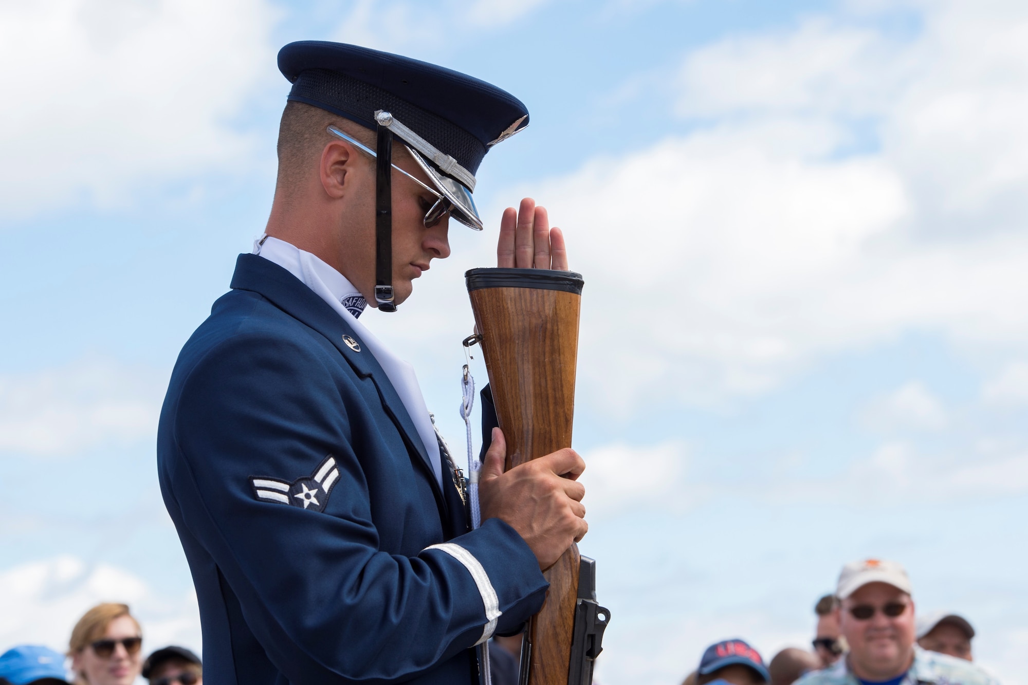 Airman 1st Class Tyler Reynolds, U.S. Air Force Honor Guard Drill Team member inspects the butt of his rifle during a four-man drill at the 58th Annual Chicago Air and Water Show on the shoreline of Lake Michigan in Chicago, Aug. 21, 2016. The show’s headliners were the USAF Thunderbirds, U.S. Army Golden Knights and the U.S. Navy Leap Frogs. (U.S. Air Force photo by Senior Airman Ryan J. Sonnier)