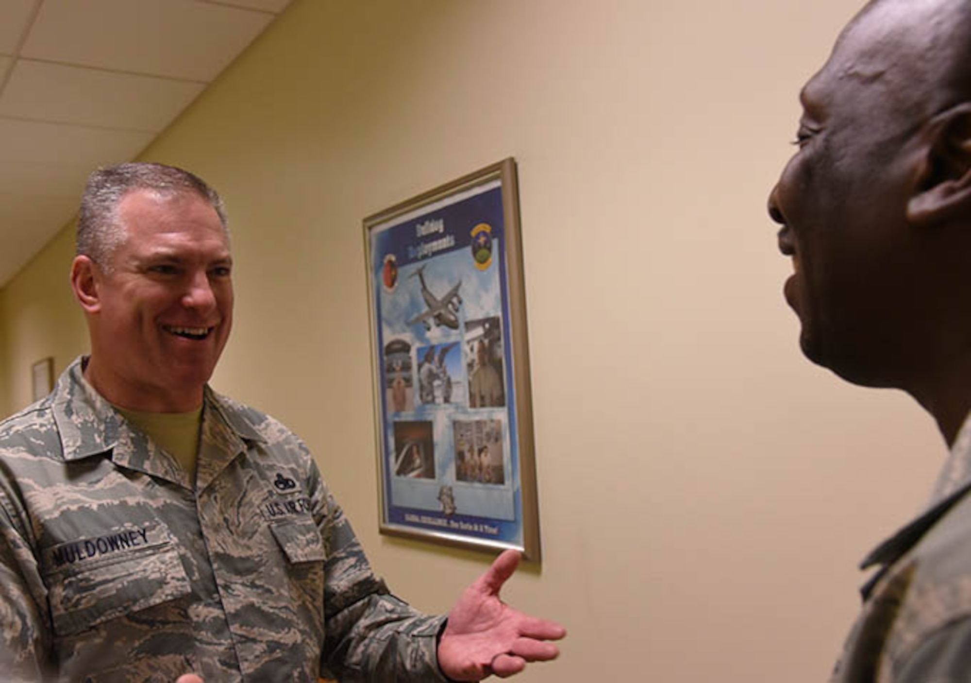 Command Chief Master Sgt. Matthew Muldowney greets a maintainer during a visit back to his old unit. In July Muldowney became the new top enlisted for the 514th Air Mobility Wing and now advises the wing commander and senior staff on matters of health, welfare and morale, and the effective utilization of nearly two thousand enlisted personnel assigned to the wing. (U.S. Air Force photo/Senior Airman Terrence Clyburn)