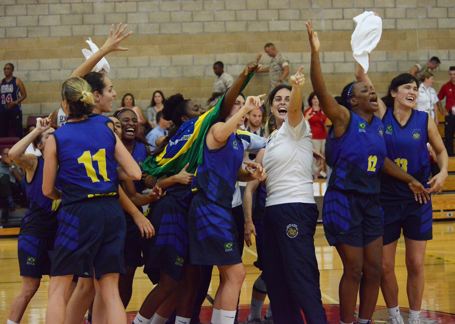 Members of the Brazil Armed Forces women's basketball team celebrate after beating Team USA 61-60 and winning gold in the CISM Military World Women's Basketball Championship, July 29, 2016 at Camp Pendleton, Calif.