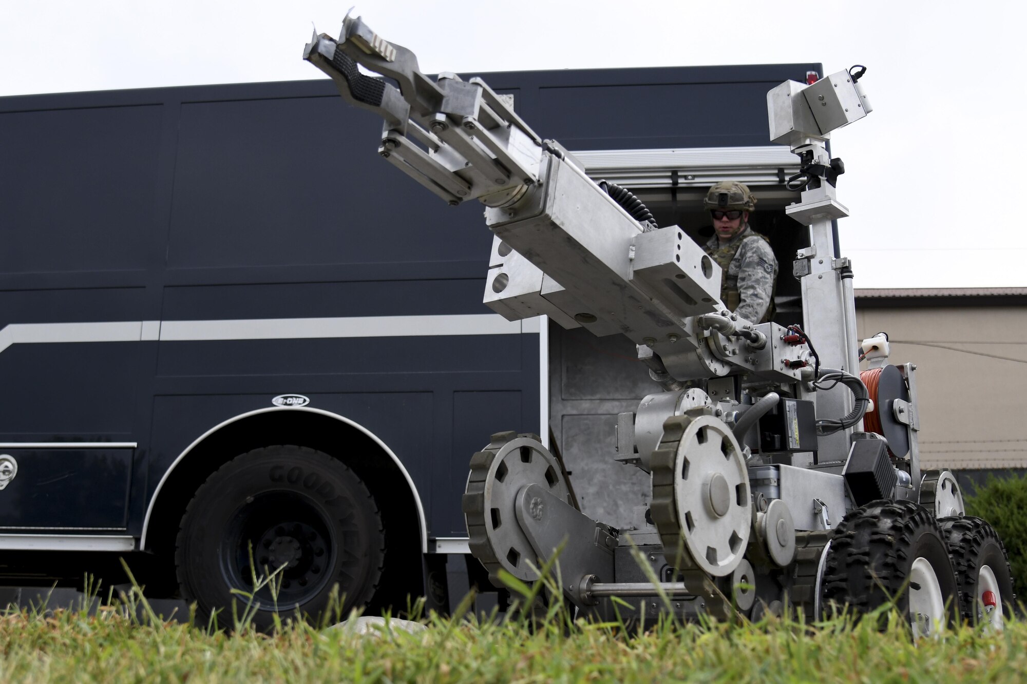 Staff Sgt. Jonmical Harry, 51st Civil Engineer Squadron explosive ordnance disposal team lead, operates an F6A EOD robot off a truck while responding to a mock improvised explosive device during exercise Beverly Herd 16-2 on Osan Air Base, Republic of Korea, Aug. 23, 2016. The mock IED was a test of first responder’s capabilities to control and safely dispose of it. (U.S. Air Force photo by Staff Sgt. Jonathan Steffen)