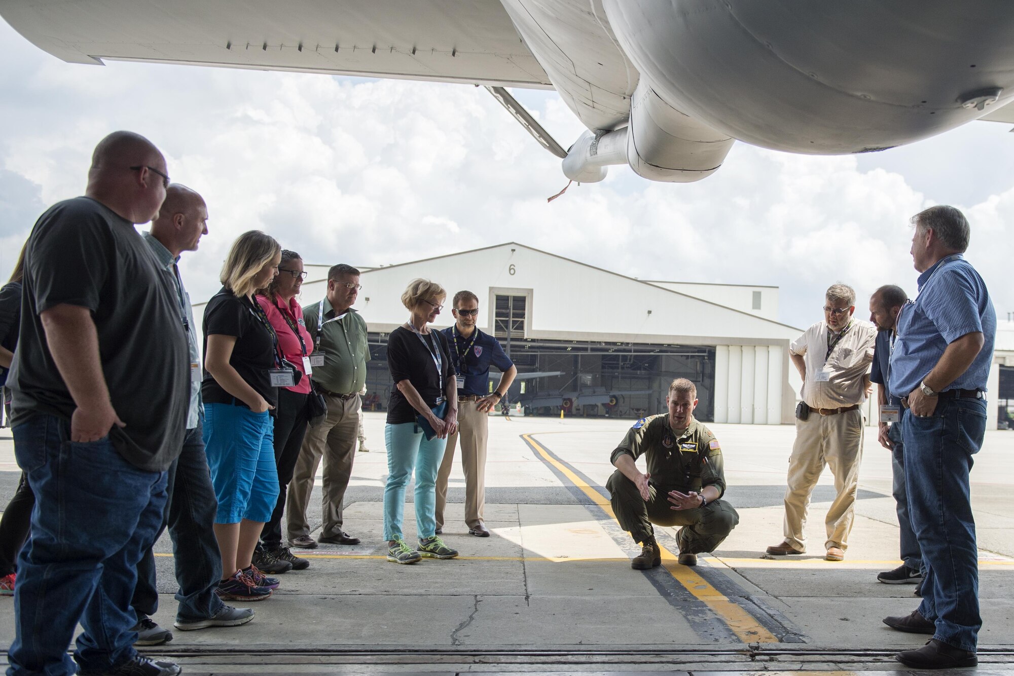 Maj. Micah Jones, 72nd Air Refueling Squadron, KC-135R Stratotanker pilot, speaks to employers of guardsmen and reservists during a tour of a KC-135R static display at Grissom Air Reserve Base, Ind., Aug. 18, 2016. During the tour, Jones explained how the aircraft boom lowers and to provide aerial refueling for a receiver aircraft. (U.S. Air Force photo/Tech. Sgt. Benjamin Mota)