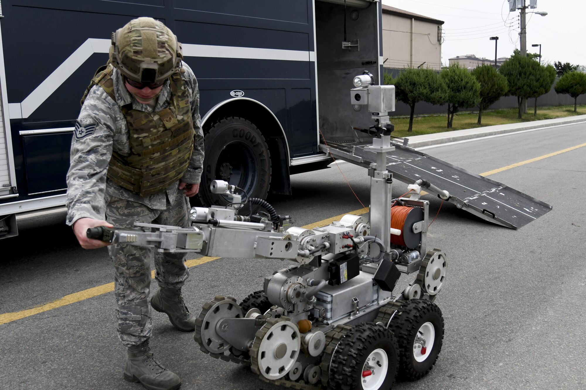 Staff Sgt. Jonmical Harry, 51st Civil Engineer Squadron explosive ordnance disposal team lead, attaches a joint chemical agent tester to an F6A EOD robot while responding to a mock improvised explosive device during exercise Beverly Herd 16-2 on Osan Air Base, Republic of Korea, Aug. 23, 2016. The JCAD is used to detect and identify chemical and biological vapors, and can be handheld or attached to an F6A EOD robot. (U.S. Air Force photo by Staff Sgt. Jonathan Steffen)