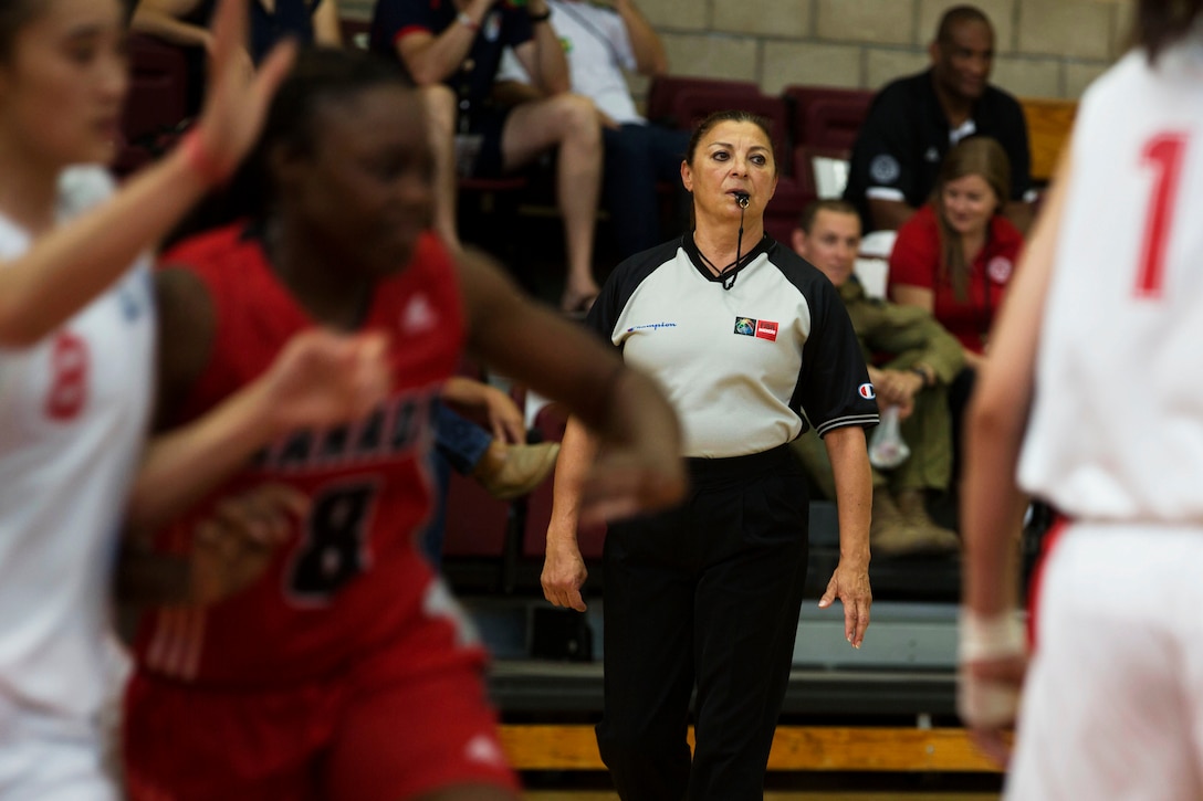 U.S. Referee Lolly Saenz officiates the China vs. Canada game at the Conseil International Du Sport Militaire (CISM) World Military Women’s Basketball Championship July 28 at Camp Pendleton, California. The base is hosting the CISM World Military Women’s Basketball Championship July 25 through July 29 to promote peace activities and solidarity among military athletes through sports.  The United States is hosting teams from Brazil, Canada, China, France, and Germany.  (U.S. Marine Corps photo by Sgt. Abbey Perria)