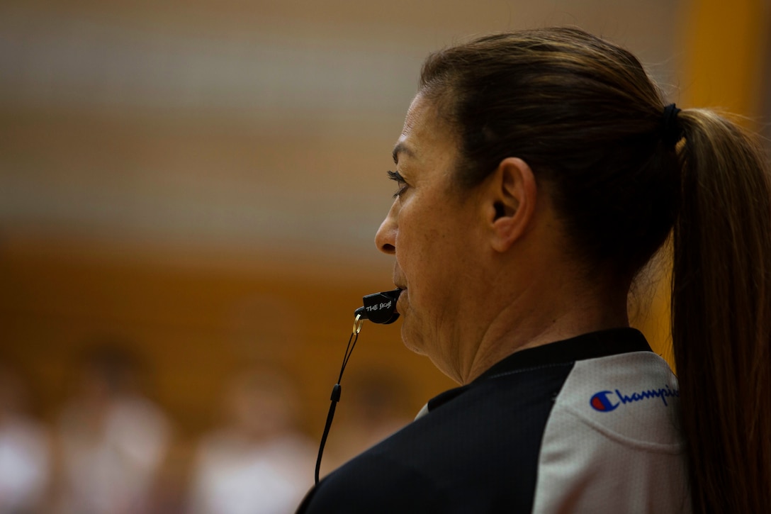 U.S. Referee Lolly Saenz Makes a call during the China vs. Canada game at the Conseil International Du Sport Militaire (CISM) World Military Women’s Basketball Championship July 28 at Camp Pendleton, California. The base is hosting the CISM World Military Women’s Basketball Championship July 25 through July 29.  The event is an opportunity for high-caliber U.S. service member athletes to be positively engaged with their peers from nations around the globe. (U.S. Marine Corps photo by Sgt. Abbey Perria)
