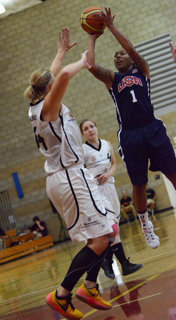 USA's Danielle Deberry of Fort Bragg, N.C., takes a jump shot as Germany's Karolin Nass defends. 
USA won the game 91-27 during the CISM Women's Basketball Chamnpionship tournament at Camp Pendleton, Calif., July 28, 2016.