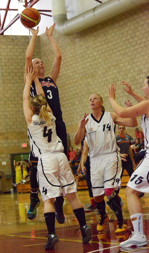 Charlene Stout of Dyess Air Force Base, Texas, takes a jump shot against Germany's Johanna Kruetzer during CISM women's basketball at Camp Pendleton, Calif., July 28, 2016. USA won the game 91-27.