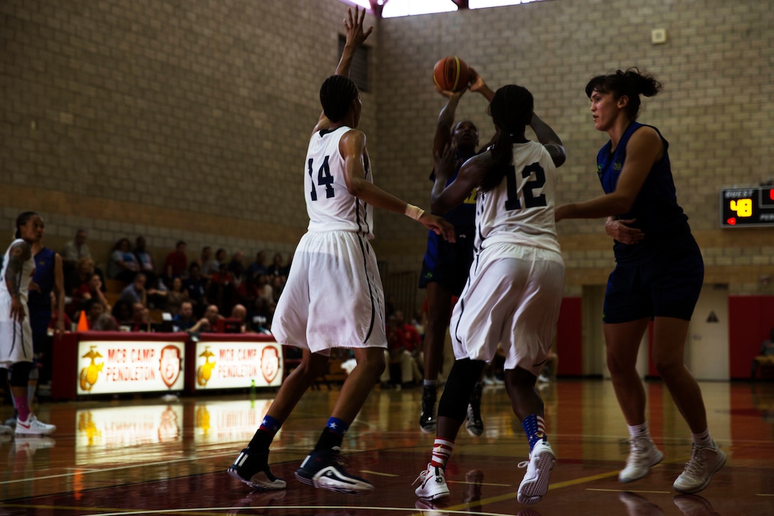 Team U.S.A. ramps up their defense during the U.S.A. vs. Brazil game at the Conseil International Du Sport Militaire (CISM) World Military Women’s Basketball Championship July 29 at Camp Pendleton, California.  The tournament ended July 29 with Brazil winning the gold. U.S.A took second place, and China will return home with the Bronze. The base hosted the CISM World Military Women’s Basketball Championship July 25 through July 29 to promote peace activities and solidarity among military athletes through sports. Teams from Canada, France, and Germany also participated in this year’s tournament.   (U.S. Marine Corps photo by Sgt. Abbey Perria)