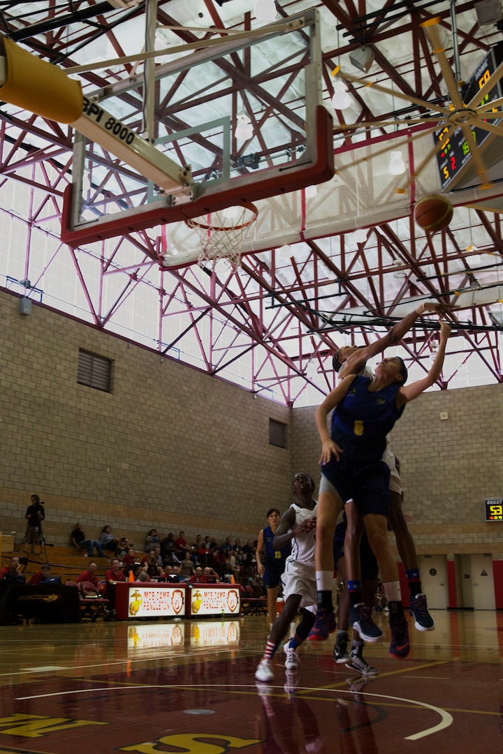 Players from team U.S.A. and team Brazil leap for the ball during the final game of the Conseil International Du Sport Militaire (CISM) World Military Women’s Basketball Championship July 29 at Camp Pendleton, California. The tournament ended July 29, with Brazil winning the gold. U.S.A took second place, and China will return home with the bronze. The base hosted the CISM World Military Women’s Basketball Championship July 25 through July 29 to promote peace activities and solidarity among military athletes through sports.  Teams from Canada, France, and Germany also participated.  (U.S. Marine Corps photo by Sgt. Abbey Perria)