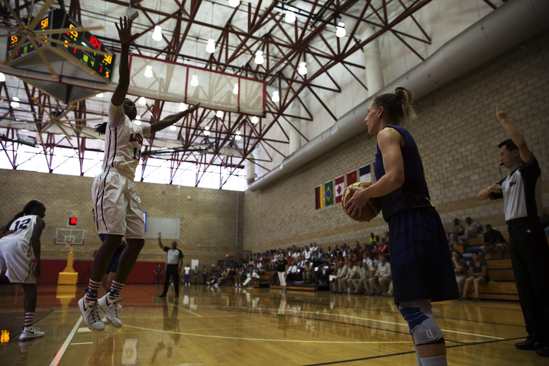 U.S. Army Sgt. Creshenda Singletary jumps up to block a shot by Brazilian Army Sgt. Karla Christina Matins Da Costa during the U.S.A. vs. Brazil game at the Conseil International Du Sport Militaire (CISM) World Military Women’s Basketball Championship July 29 at Camp Pendleton, California. The tournament ended July 29, with Brazil winning the gold. U.S.A took second place, and China will return home with the bronze. The base hosted the CISM World Military Women’s Basketball Championship July 25 through July 29 to promote peace activities and solidarity among military athletes through sports.  Teams from Canada, France, and Germany also participated.  (U.S. Marine Corps photo by Sgt. Abbey Perria)