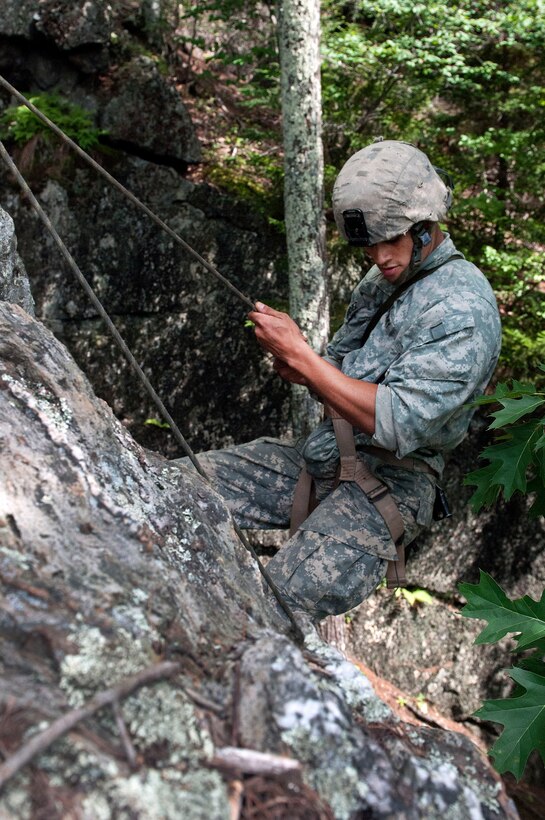 A soldier rappels down a cliff face at Camp Ethan Allen Training Site in Jericho, Vt., Aug. 21, 2016. Army National Guard photo by Spc. Avery Cunningham