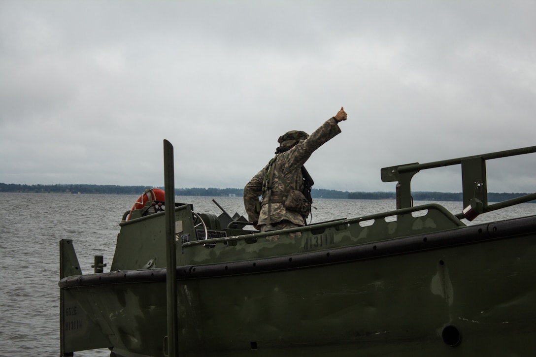 FORT MCCOY, Wis. – A U.S. Army Reserve Soldier, with the 652d Multi-Role Bridge Company of Hammond, Wis., deploys boat into Petenwell Lake, Wis., in August 2016. His boat is a vital piece of equipment in assembling and controlling floating bridge sections. The combat support training exercise allows U.S. Army Reserve units, like the 652d, to practice their skills in a real environment. (U.S. Army Reserve Photo by Sgt. Clinton Massey, 206th Broadcast Operations Detachment/Released)