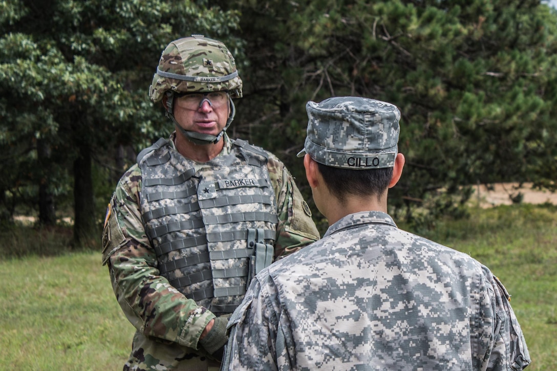 FORT MCCOY, Wis. – In August 2016, U.S. Army Reserve Brig. Gen. Vincent Barker, Commanding General of the 310th Expeditionary Sustainment Command, is interviewed by U.S. Army Reserve 1st Lt. Angelina Cillo of the 366th Mobile Public Affairs Detachment from Wichita, Kan. Exercise News Day is tasked to provide public affairs support during annual training, like combat support training exercise, throughout the U.S. Army Reserve.  (U.S. Army Reserve Photo by Sgt. Clinton Massey, 206th Broadcast Operations Detachment/Released)