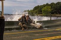 FORT MCCOY, Wis. – U.S. Army Reserve Soldiers with the 652d Multi-Role Bridge Company of Hammond, Wis. have a splash in August 2016. The 652d assembles a raft on Petenwell Lake, Wis. and maneuvers vehicles and Soldiers across large bodies of water as part of the combat support training exercise. The CSTX held at Fort McCoy, allows U.S. Army Reserve units, like the 652d, to practice their skills in a real environment. (U.S. Army Reserve Photo by Sgt. Clinton Massey, 206th Broadcast Operations Detachment/Released)