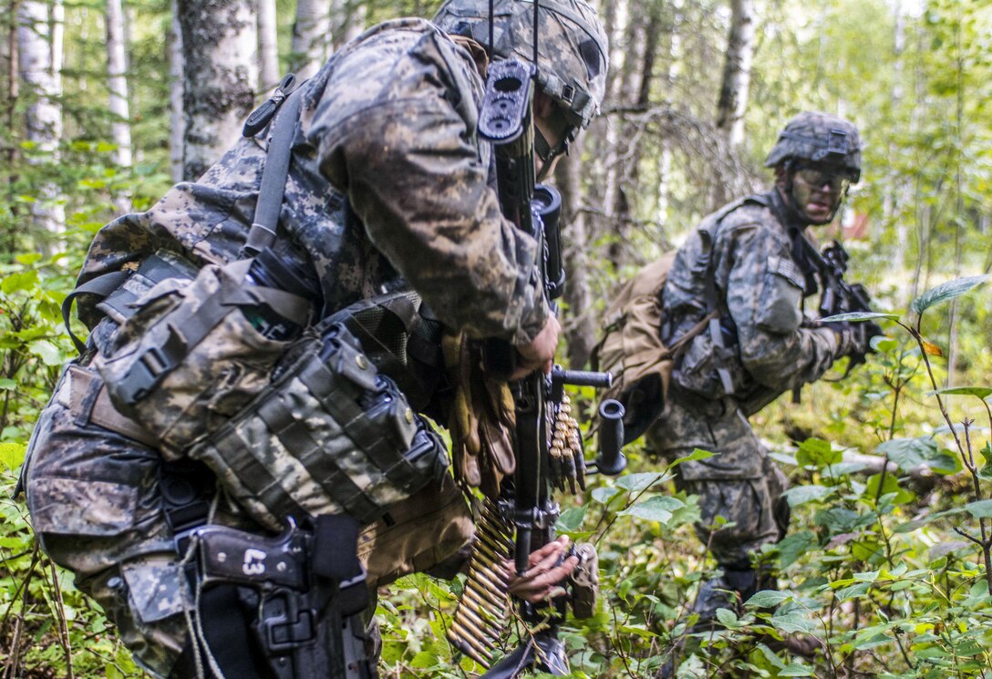 Soldiers react to contact during exercise Spartan Agoge at Joint Base Elmendorf-Richardson, Alaska, Aug. 18, 2016. The battalion trained in close combat, reconnaissance, chemical warfare and infiltration skills. The soldiers are assigned to Company C, 1st Battalion, 501st Parachute Infantry Regiment, 4th Infantry Brigade Combat Team (Airborne). Army photo by Staff Sgt. Daniel Love