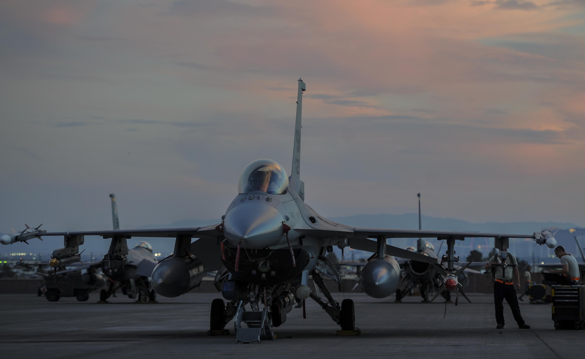 An F-16CJ, assigned to the 79th Fighter Squadron, Shaw Air Force Base, S.C., sits on the flightline during Red Flag 16-3 before take-off at Nellis Air Force Base, Nevada, July 25, 2016. Airmen from the National Air and Space Intelligence Center Operational Requirements Squadron’s Weapons and Tactics Team integrated non-kinetic effects into the exercise, providing pilots the ability to train against cyber threats. (U.S. Air Force photo by Airman 1st Class Kevin Tanenbaum/Released)
