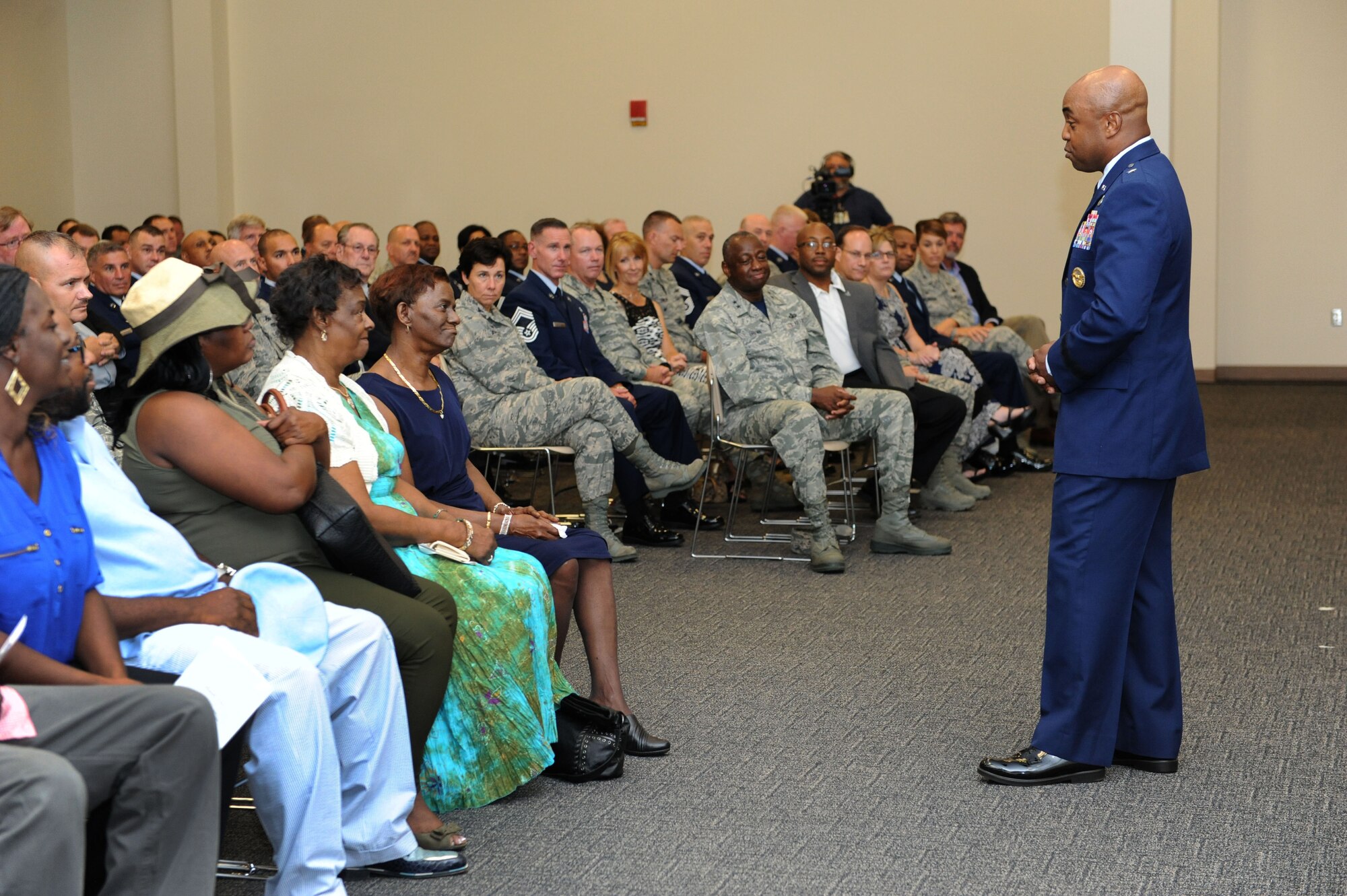 Brig. Gen. Trent Edwards, Headquarters Air Force Space Command financial management and comptroller director, Peterson Air Force Base, Colo., delivers remarks about the career of Chief Master Sgt. Harry Hutchinson, 81st Training Wing command chief, during his retirement ceremony at the Roberts Consolidated Aircraft Maintenance Facility Aug. 19, 2016, on Keesler AFB, Miss. Hutchinson retired with more than 29 years of military service and served multiple assignments in Washington, Korea, Maryland, Japan, Nevada, South Dakota and Africa. He also worked as the superintendent of the U.S. Army’s RED HORSE sites in Iraq and Afghanistan and the Air Force’s 732nd Expeditionary Prime BEEF squadron. (U.S. Air Force photo by Kemberly Groue/Released)