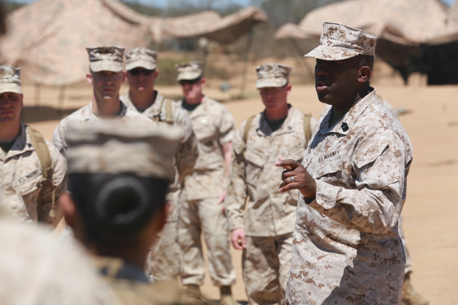 The 18th Sergeant Major of the Marine Corps, Ronald L. Green, speaks with Marines of Combat Logistics Battalion 15, Headquarters Regiment, 1st Marine Logistics Group, during a Tactical Convoy Course on Camp Pendleton Calif., Aug. 16, 2016. Sergeant Major Green discussed issues with in the Marine Corps and protecting that you earn. (Official U.S. Marine Corps photo by Sgt. Rodion Zabolotniy)