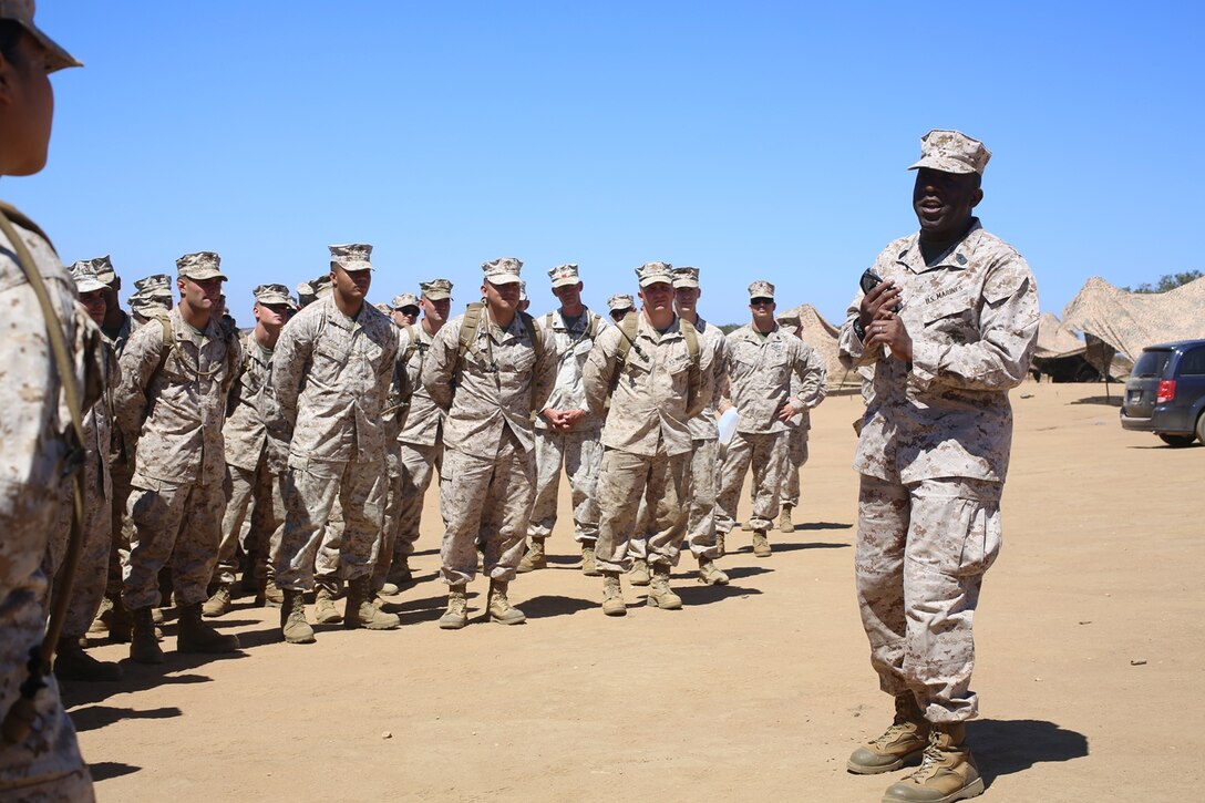 The 18th Sergeant Major of the Marine Corps, Ronald L. Green, speaks with Marines of Combat Logistics Battalion 15, Headquarters Regiment, 1st Marine Logistics Group, during a Tactical Convoy Course on Camp Pendleton Calif., Aug. 16, 2016. Sergeant Major Green discussed issues with in the Marine Corps and protecting that you earn. (Official U.S. Marine Corps photo by Sgt. Rodion Zabolotniy)