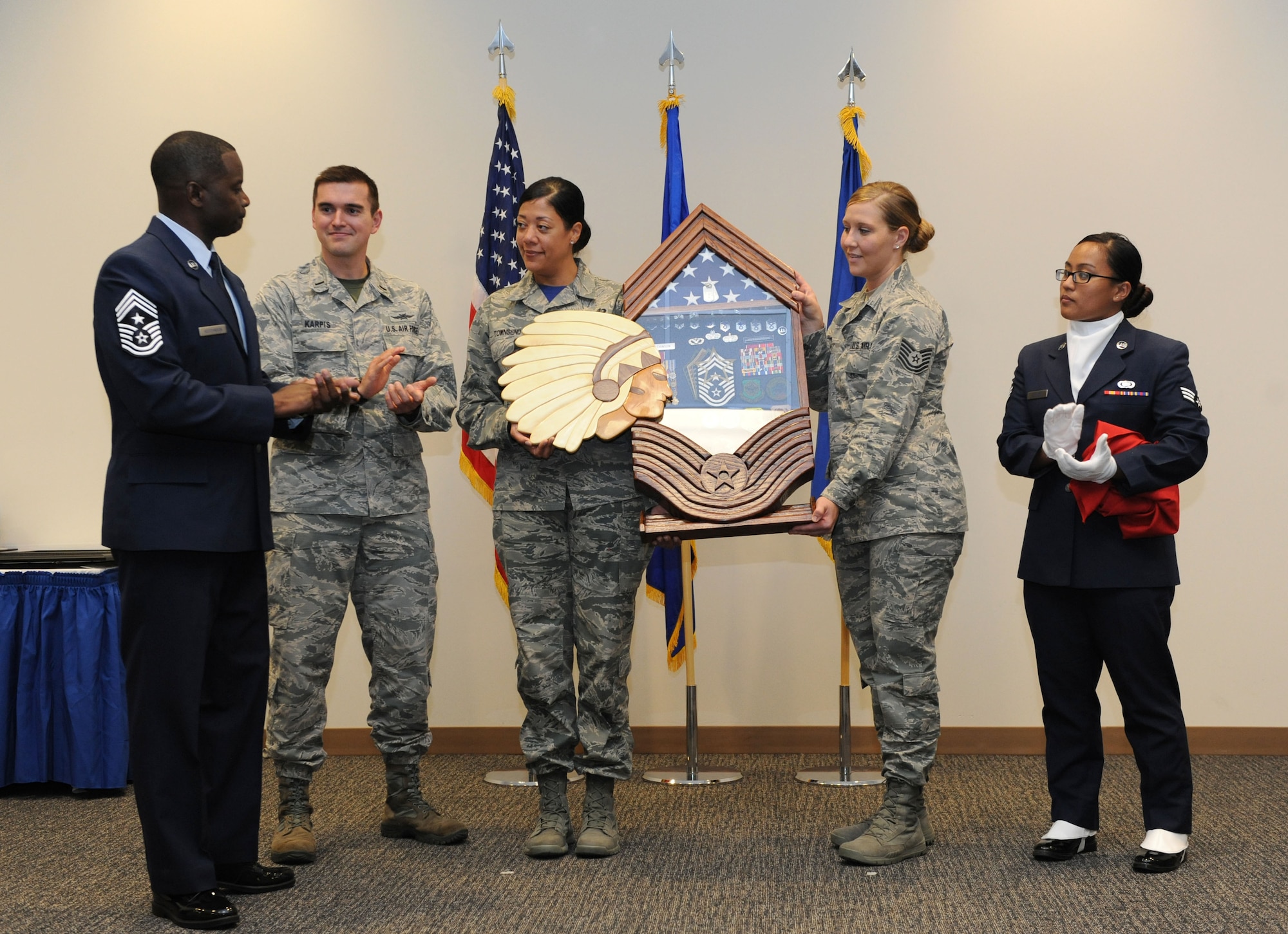 Members of different base private organizations present Chief Master Sgt. Harry Hutchinson, 81st Training Wing command chief, a gift during his retirement ceremony at the Roberts Consolidated Aircraft Maintenance Facility Aug. 19, 2016, on Keesler Air Force Base, Miss. Hutchinson retired with more than 29 years of military service and served multiple assignments in Washington, Korea, Maryland, Japan, Nevada, South Dakota and Africa. He also worked as the superintendent of the U.S. Army’s RED HORSE sites in Iraq and Afghanistan and the Air Force’s 732nd Expeditionary Prime BEEF squadron. (U.S. Air Force photo by Kemberly Groue/Released)