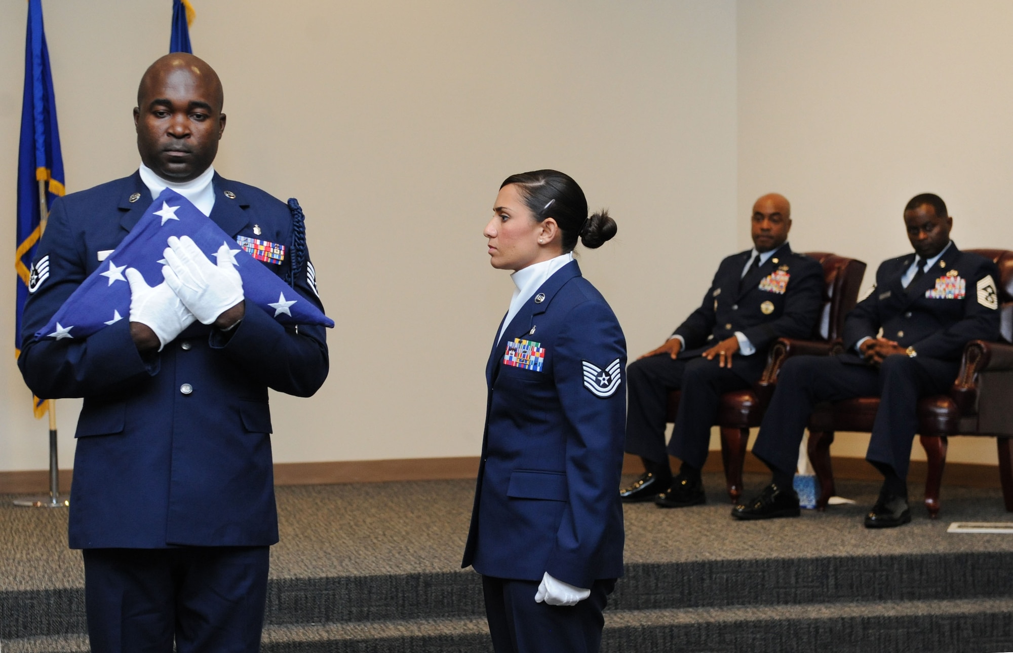 Staff Sgt. Robinson Divert, 334th Training Squadron military training leader, and Tech. Sgt. Carleen Wallace, 81st Aerospace Medicine Squadron Base Operation Medicine Cell flight chief, participate in a parade of ranks during the retirement ceremony honoring Chief Master Sgt. Harry Hutchinson, 81st Training Wing command chief, at the Roberts Consolidated Aircraft Maintenance Facility Aug. 19, 2016, on Keesler Air Force Base, Miss. Hutchinson retired with more than 29 years of military service and served multiple assignments in Washington state, Korea, Maryland, Japan, Nevada, South Dakota and Africa. He also worked as the superintendent of the U.S. Army’s RED HORSE sites in Iraq and Afghanistan and the Air Force’s 732nd Expeditionary Prime BEEF squadron. (U.S. Air Force photo by Kemberly Groue/Released)