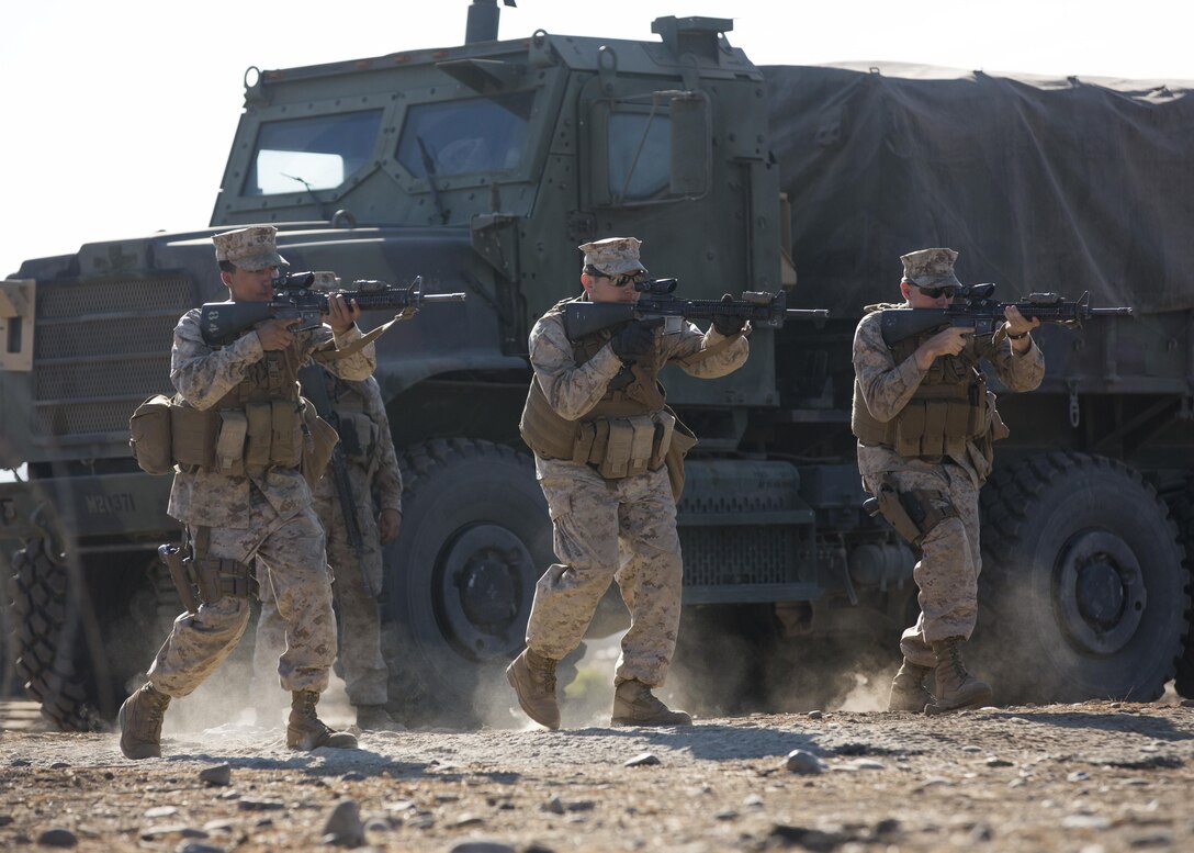 U.S. Marines with Company A, Law Enforcement Battalion, I Marine Expeditionary Force Headquarters Group, practice weapons training during I MEF Large Scale Exercise 2016 at Marine Corps Air Station Miramar, Calif., Aug. 17, 2016. LSE-16 simulates the planning, deployment and combat operations of a MEF-level force of more than 50,000 military members within a partner country while operating alongside coalition forces. The exercise includes cyber and electronic warfare, information support operations, and simulated and live-fire events. (U.S. Marine Corps photo by Sgt. Tia Dufour)
