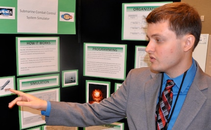 DAHLGREN, Va. — University of North Carolina student Daniel Antoshak presents his research on "Submarine Combat Control System Simulator” to military and government personnel  during his 2016 summer internship. Antoshak - among 22 students who completed their internships at Naval Surface Warfare Center Dahlgren Division (NSWCDD) - is working towards a bachelor’s degree in computer and electrical engineering. The Naval Research Enterprise Intern Program (NREIP) encourages students to pursue science and engineering careers, furthers education via mentoring and their participation in research, and makes them aware of Navy research and technology efforts, which can lead to civilian employment within the Navy. 