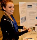 DAHLGREN, Va. — Western Kentucky University student Abbie Schopper explains a prototype pitot static air velocity probe tested for use in a shipboard duct while briefing Navy personal during her 2016 summer  internship, sponsored by the Naval Research Enterprise Intern Program (NREIP). “Throughout this summer, I have enjoyed my experience working here at Dahlgren, but I also feel like I have gained important experiences that are not found in the undergraduate curriculum,” said Schopper, who is pursuing a bachelor’s degree in mechanical engineering. “I would recommend NREIP to anyone with a STEM major, and would love to return.” Schopper’s project focused on air flow rate measurements for the shipboard Collective Protection System (CPS).  Shipboard CPS air flow measurement procedures and instruments were selected decades ago based on instrumentation available at that time. With the development of variable speed drive control and automation of CPS, more accurate air flow measurements are needed. “Abbie determined an accurate method for measuring air flow in Collective Protection System zones installed with variable speed drive controls to decrease the air flow in non-threatening situations,” said Will Clark, NSWCDD mechanical engineer and CPS expert. 
