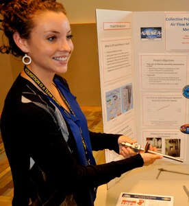 DAHLGREN, Va. — Western Kentucky University student Abbie Schopper explains a prototype pitot static air velocity probe tested for use in a shipboard duct while briefing Navy personal during her 2016 summer  internship, sponsored by the Naval Research Enterprise Intern Program (NREIP). “Throughout this summer, I have enjoyed my experience working here at Dahlgren, but I also feel like I have gained important experiences that are not found in the undergraduate curriculum,” said Schopper, who is pursuing a bachelor’s degree in mechanical engineering. “I would recommend NREIP to anyone with a STEM major, and would love to return.” Schopper’s project focused on air flow rate measurements for the shipboard Collective Protection System (CPS).  Shipboard CPS air flow measurement procedures and instruments were selected decades ago based on instrumentation available at that time. With the development of variable speed drive control and automation of CPS, more accurate air flow measurements are needed. “Abbie determined an accurate method for measuring air flow in Collective Protection System zones installed with variable speed drive controls to decrease the air flow in non-threatening situations,” said Will Clark, NSWCDD mechanical engineer and CPS expert. 