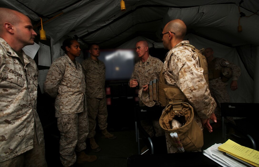 U.S. Marine Sgt. Maj. Bradley Kasal speaks to Marines with the 1st Marine Logistic Group G-6 shop, during the I Marine Expeditionary Force Large Scale Exercise 16 at Camp Pendleton, Calif., Aug. 19, 2016. Kasal is the I MEF sergeant major. LSE 16 tests I MEF’s ability to plan, deploy, and command and control a force of more than 50,000 Marines and Sailors against a near-peer enemy force. The exercise tests 1st MLG’s ability to provide sufficient, agile, flexible and responsive tactical level logistics to I MEF forces in support of operations. (U.S. Marine Corps photo illustration by Sgt. Laura Gauna/ released)