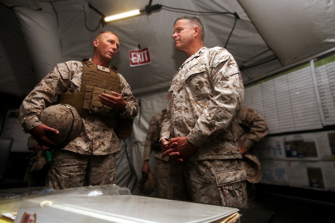 U.S. Marine Col. James R. Hensien speaks to Lt. Gen. Lewis A. Craparotta during the I Marine Expeditionary Force Large Scale Exercise 16 at Camp Pendleton, Calif., Aug. 19, 2016. Craparotta is the I MEF commanding general and Hensien is the 1st Marine Logistics Group chief of staff. LSE 16 tests I MEF’s ability to plan, deploy, and command and control a force of more than 50,000 Marines and Sailors against a near-peer enemy force. The exercise tests 1st MLG’s ability to provide sufficient, agile, flexible and responsive tactical level logistics to I MEF forces in support of operations. (U.S. Marine Corps photo illustration by Sgt. Laura Gauna/ released)