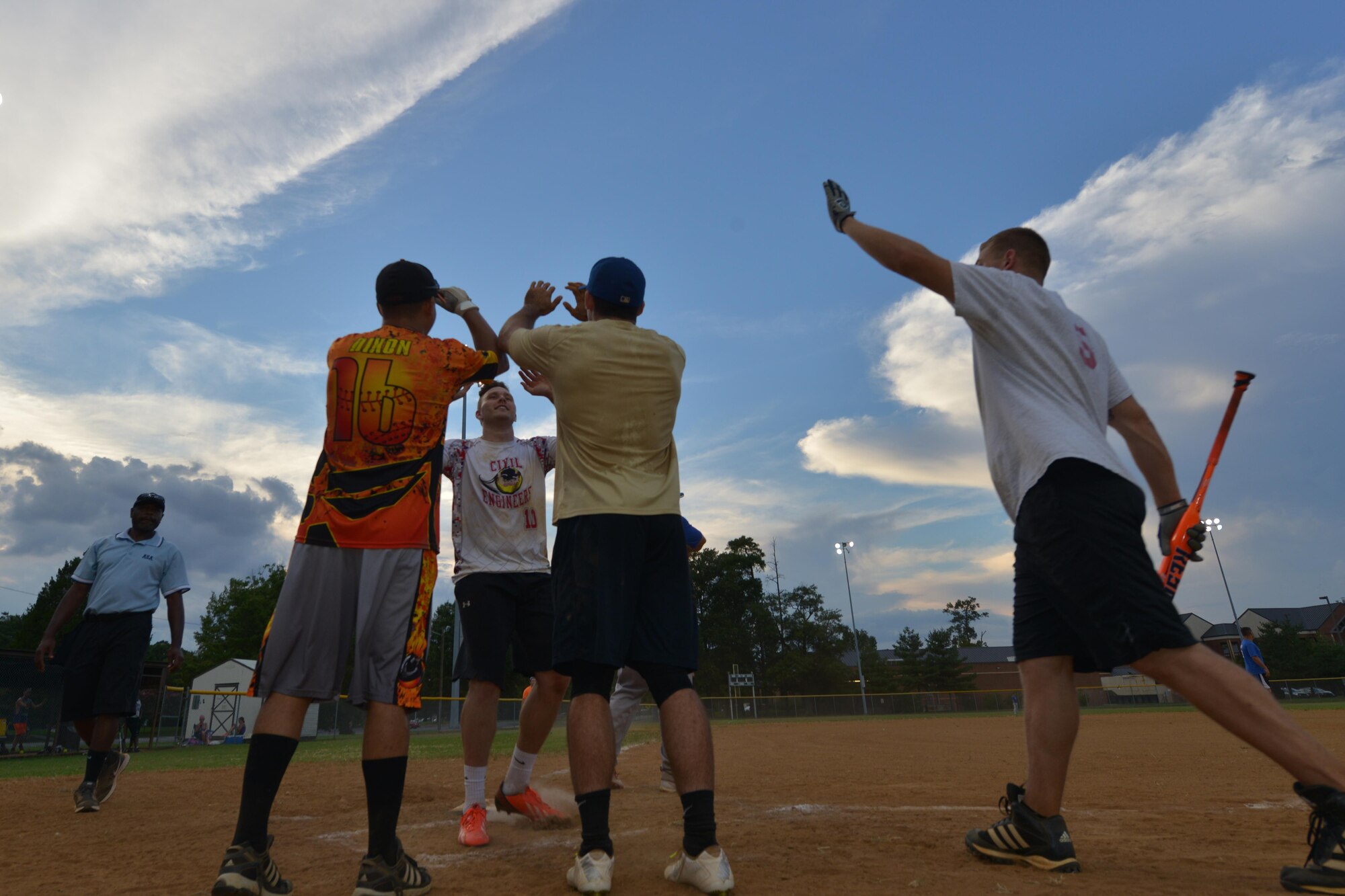 Langley All-Stars team members celebrate a homerun during the Joint Base Langley-Eustis Commander’s Cup Softball Championship at Fort Eustis, Va., Aug. 17, 2016. The Commander’s Cup competition aims to promote physical fitness, morale and esprit de corps through athletic competition.  (U.S. Air Force photo by Staff Sgt. Nastasha Stannard)