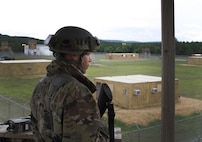 FORT MCCOY, Wis. – U.S. Army Reserve Soldier, Pfc. David Martinez, a military policeman with the 301st MP Company, Puerto Rico, and San Lorenzo native, stands watch as a tower guard over a simulated theater detention facility during a combat support training exercise at Fort McCoy, Wis., Aug. 19, 2016. The 301st was tasked with providing base defense during the exercise, which included foxhole perimeter defense, TDF security, quick reaction force teams and entry control point teams. (U.S. Army Reserve Photo by Sgt. Quentin Johnson, 211th Mobile Public Affairs Detachment/Released)