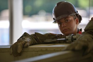 U.S. Army Pvt. Lidsy Sarmiento, Maritime and Intermodal Training Department cargo specialist student, listens as her instructors teach air movement cargo techniques at Fort Eustis, Va., Aug. 22, 2016. Cargo specialists learn how to load equipment on multiple platforms including vessels, trains, transport vehicles and aircraft. (U.S. Air Force photo by Staff Sgt. Natasha Stannard)
